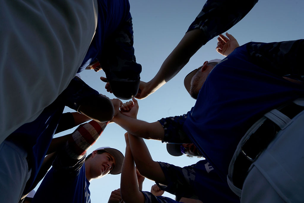 Battle High School baseball players huddle up